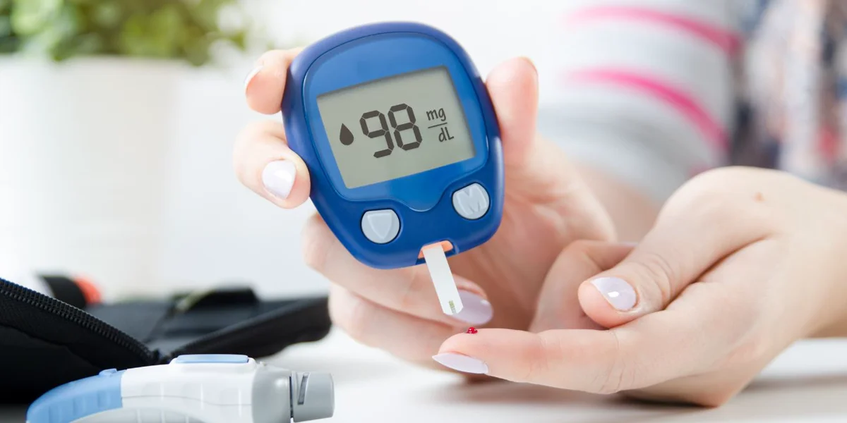 Blood sugar test showing 98 mg/dl highlighting the importance of managing blood sugar levels to reduce the risk of alzheimer's disease.