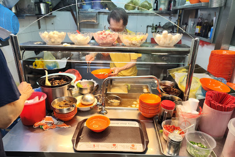 Blue Star's cook preparing order for customer