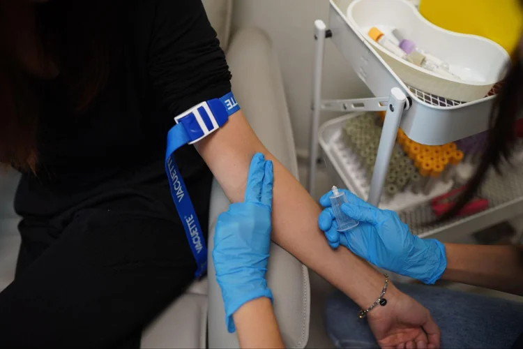 Asian woman getting tested for STDs.