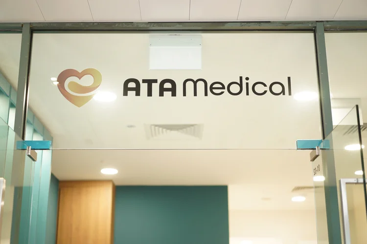 ATA Medical clinic signage at front desk of clinic offering men’s health screening in Singapore.
