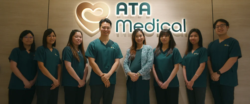 ATA Medical staff in front of clinic signage offering customised health screening packages.
