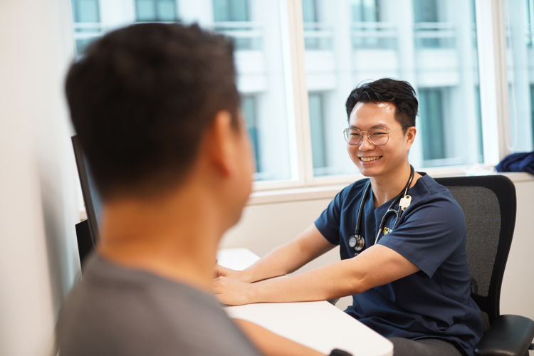 ATA Medical doctor providing consultation to an Asian man for a men’s health concern.