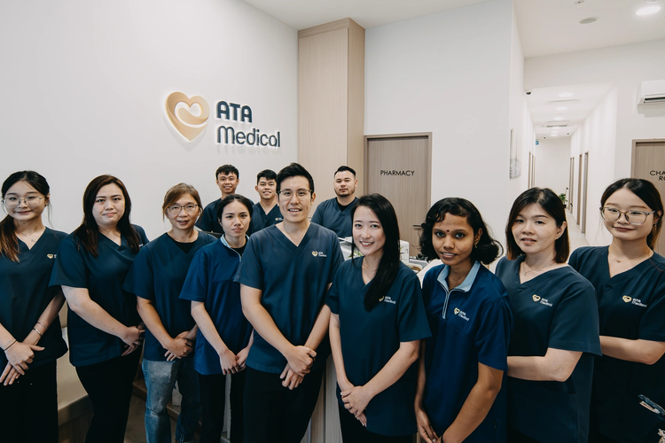 ATA Medical Jurong Clinic team of doctors and staff standing together in the clinic lobby.