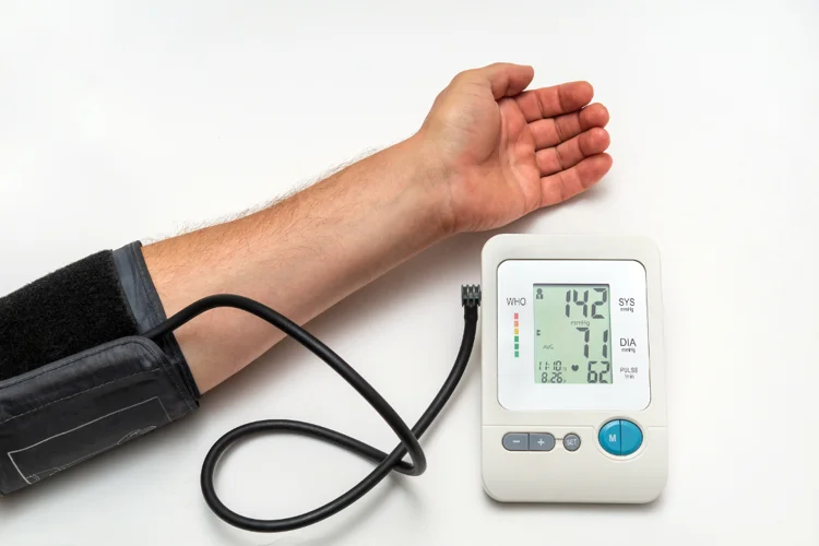 Blood pressure of a man being measured over a period of time to assess for hypertension.