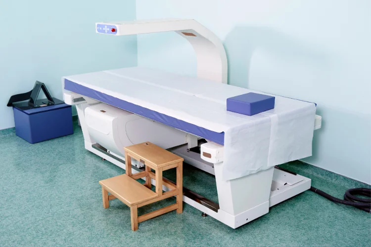 Bone density test machine used to measure the mineral content and strength of bones, assess osteoporosis risk, prevent fractures, and monitor bone health.