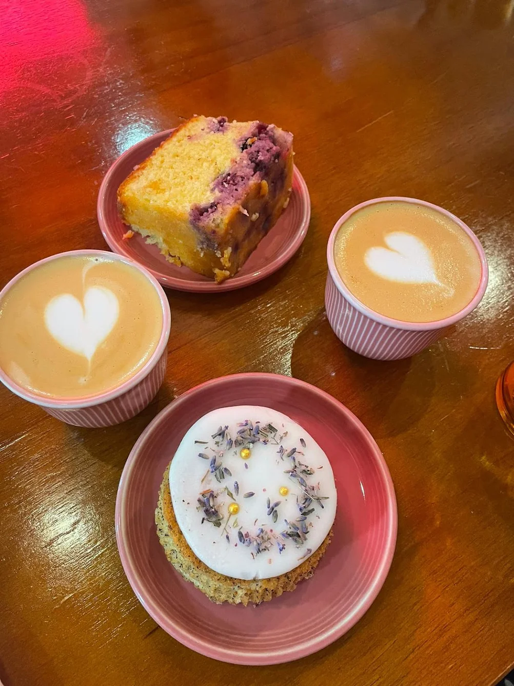 Lavender cake and coffee at The Community Coffee Singapore with latte heart art and desserts.