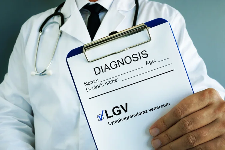 Doctor showing Lymphogranuloma Venereum (LGV) diagnosis on clipboard during STD consultation.