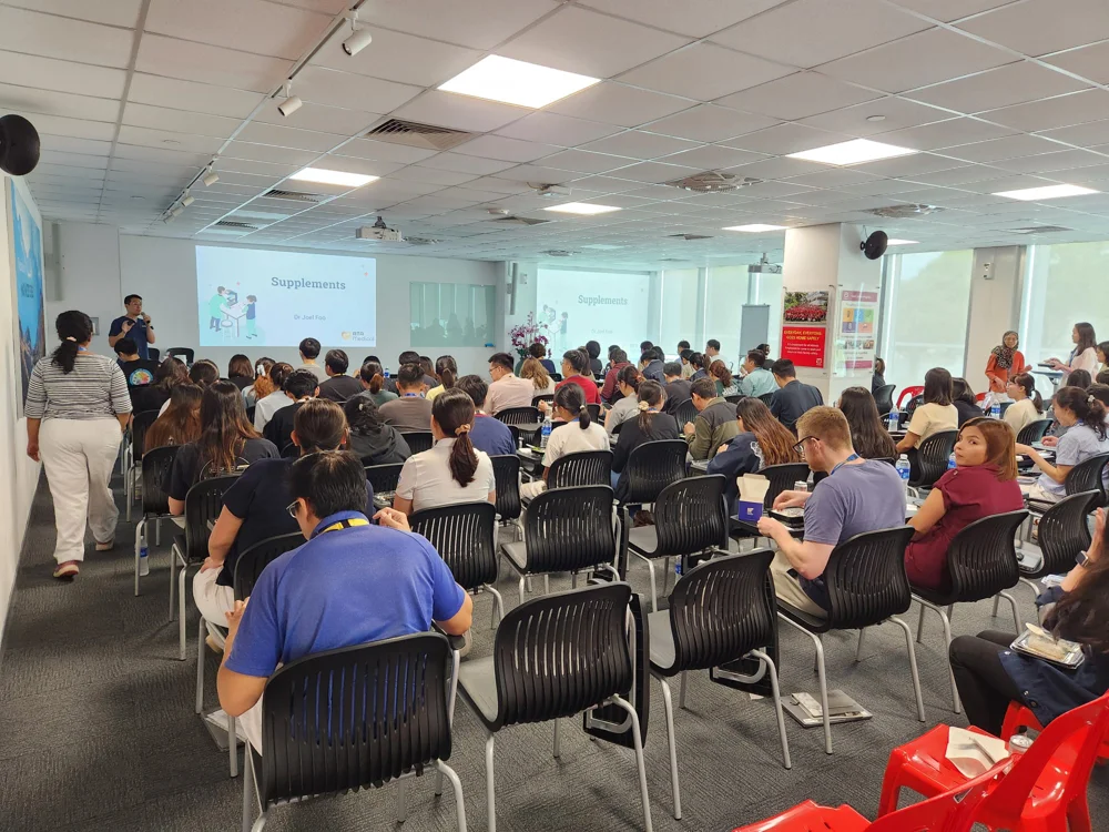 Dr. Joel Foo of ATA Medical conducting health screening talk session for MNC employees.