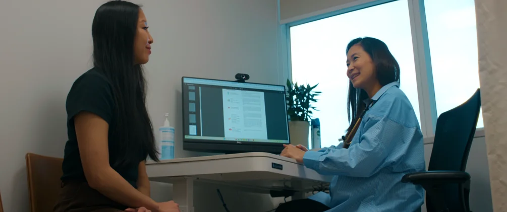 Dr Lydia Tan of ATA Medical having post health screening consultation with female patient.