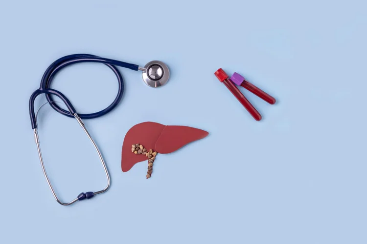 Hepatitis B Screening Test depicted with a stethoscope, 2 vials and cut out model of a kidney.