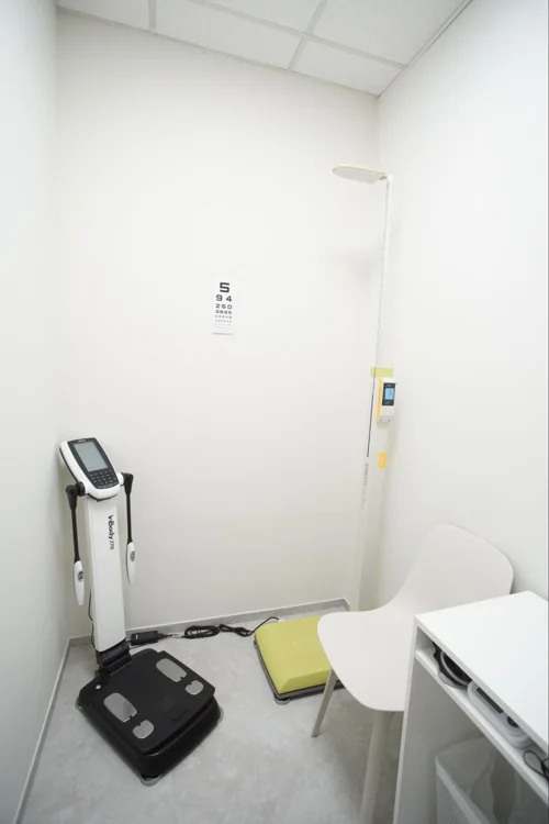 Machines and equipment used to measure a person's height and weight as part of basic health screening in Singapore.