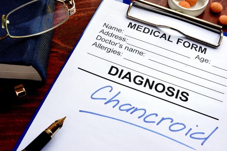 Medical form with chancroid diagnosis showing confirmed sexually transmitted bacterial infection.