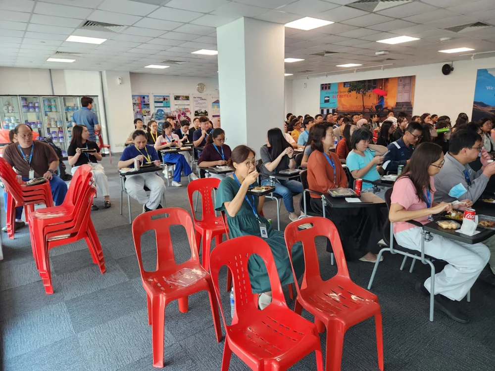 MNC employees having a lunch break during health talk session.