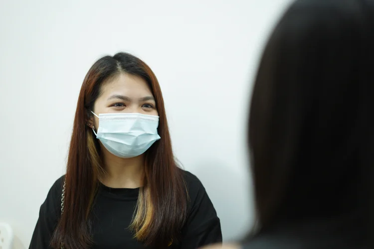 Singaporean woman consulting a female doctor at ATA Medical, a women’s health clinic committed to providing a secure, confidential, and welcoming space for women’s health issues.