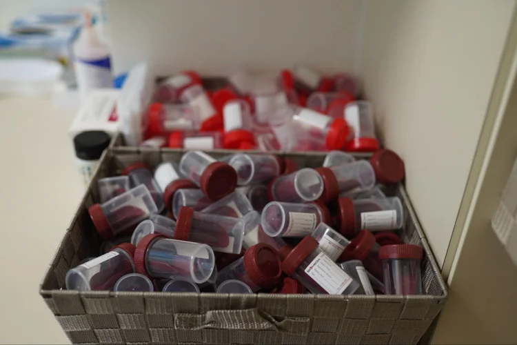 2 baskets filled with empty containers to be used for storing patients' blood for various tests.